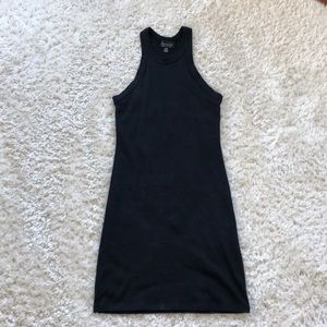 Tight short black dress.